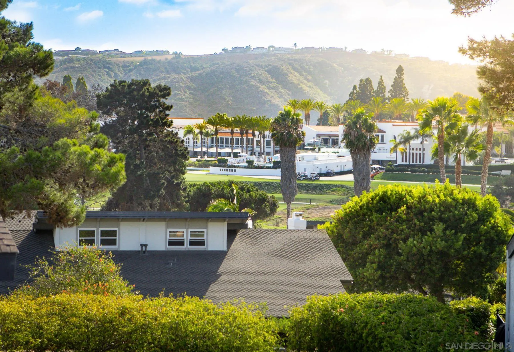 7325 Alicante Road, Unit A Carlsbad, CA 92009 - Photo 30 of 44 a view of a city with a building in the background