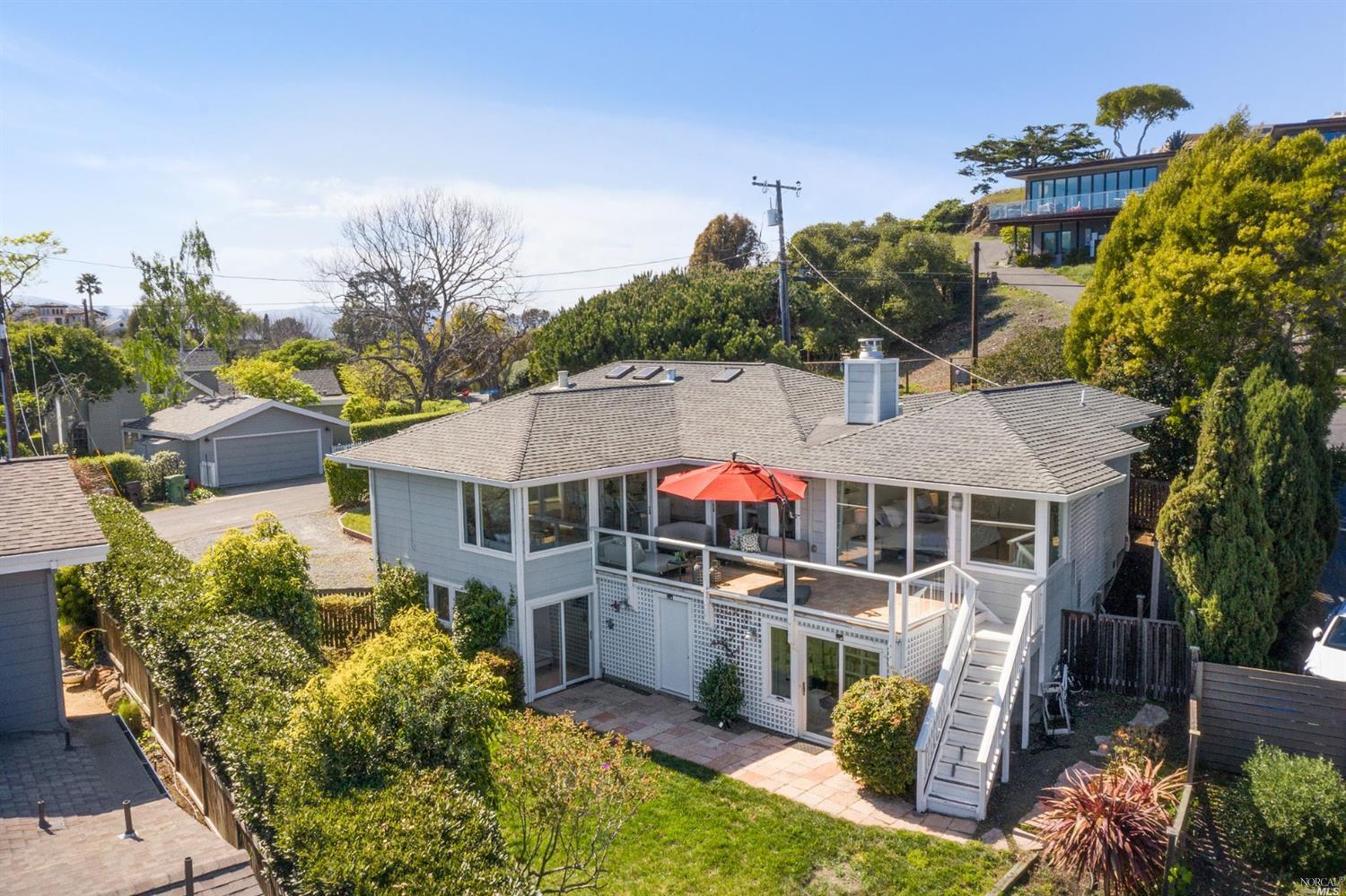 a aerial view of a house with a yard