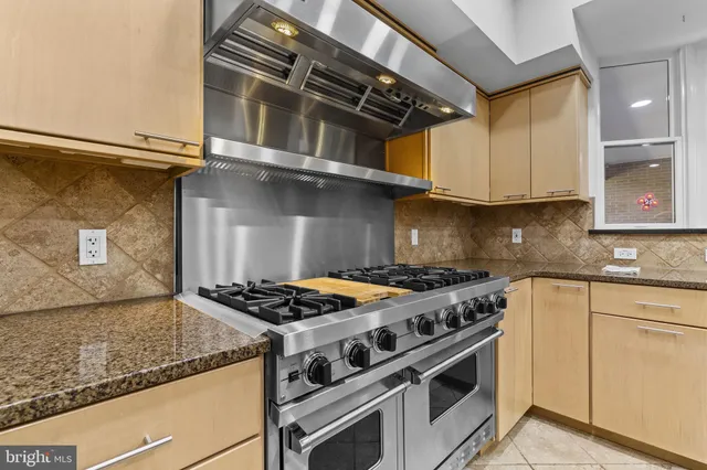 a bedroom with a bed and a ceiling fan