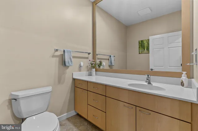 a view of a kitchen with kitchen island and living room