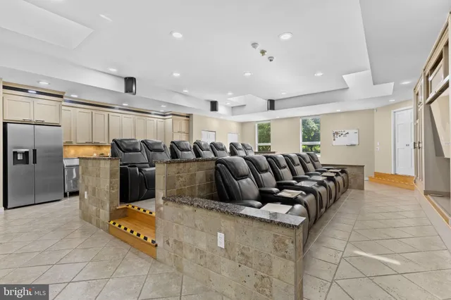 a bedroom with a bed and a ceiling fan