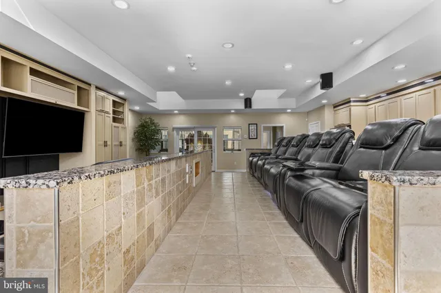 a bed room with a bed and a ceiling fan