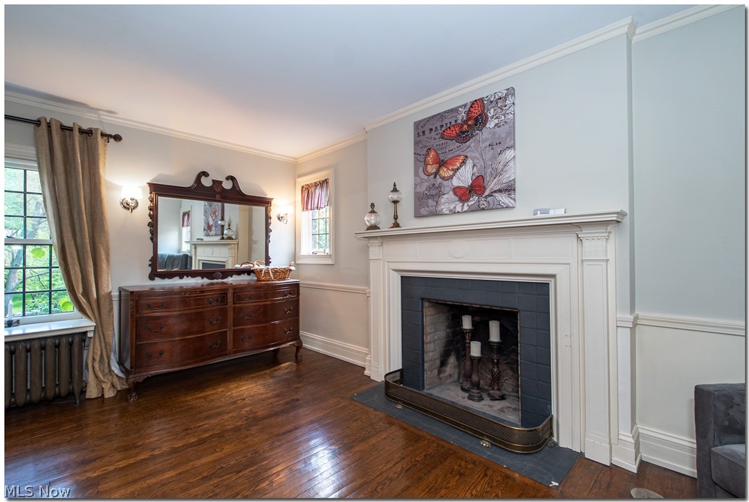 2820 Paxton Road Cleveland, OH 44120 - Photo 21 of 34 The master suite also offers a fireplace with a pretty wooden surround, and wainscoting.