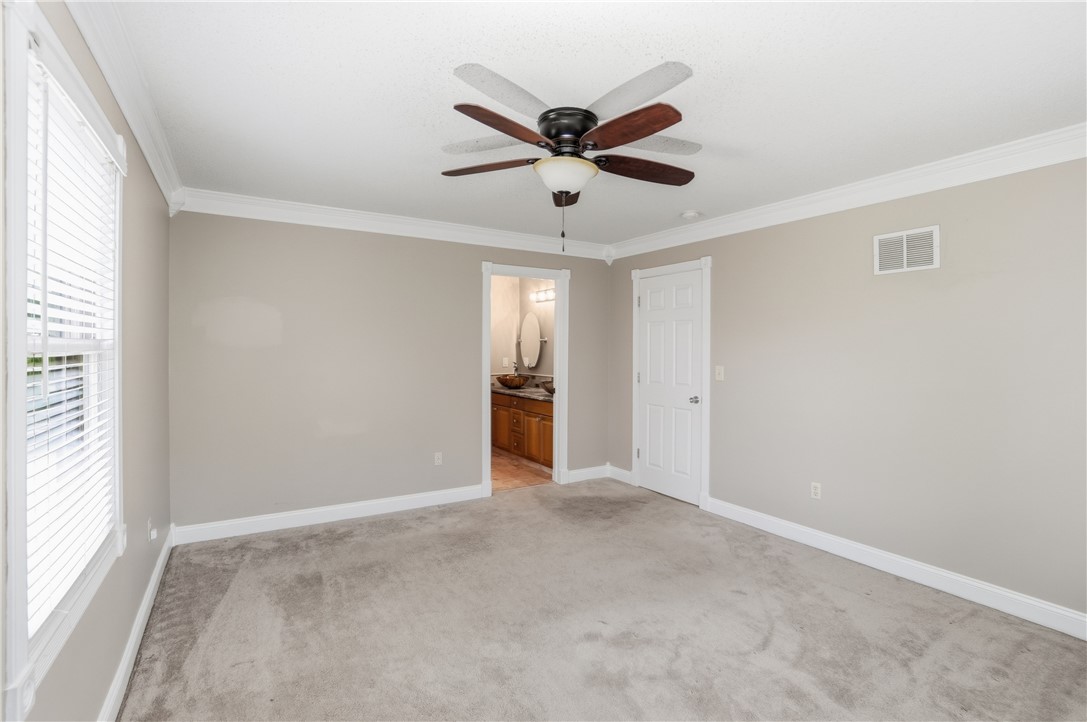 1208 Jarva Lane Springboro, OH 45066 - Photo 32 of 75 This spacious bedroom offers ample natural light and direct access to a private bathroom.