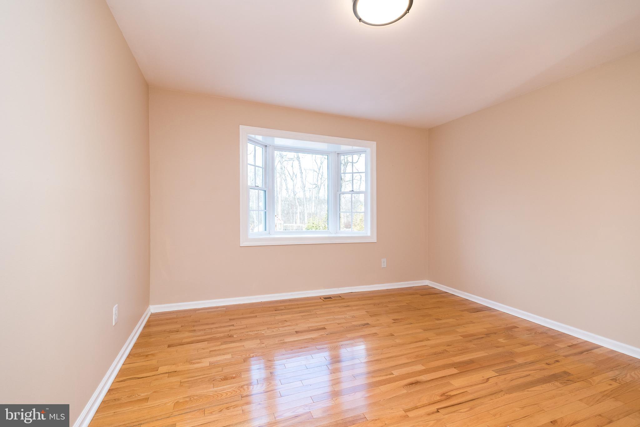 46 John Dyer Way Doylestown, PA 18902 - Photo 16 of 76 a view of a room with wooden floor and windows