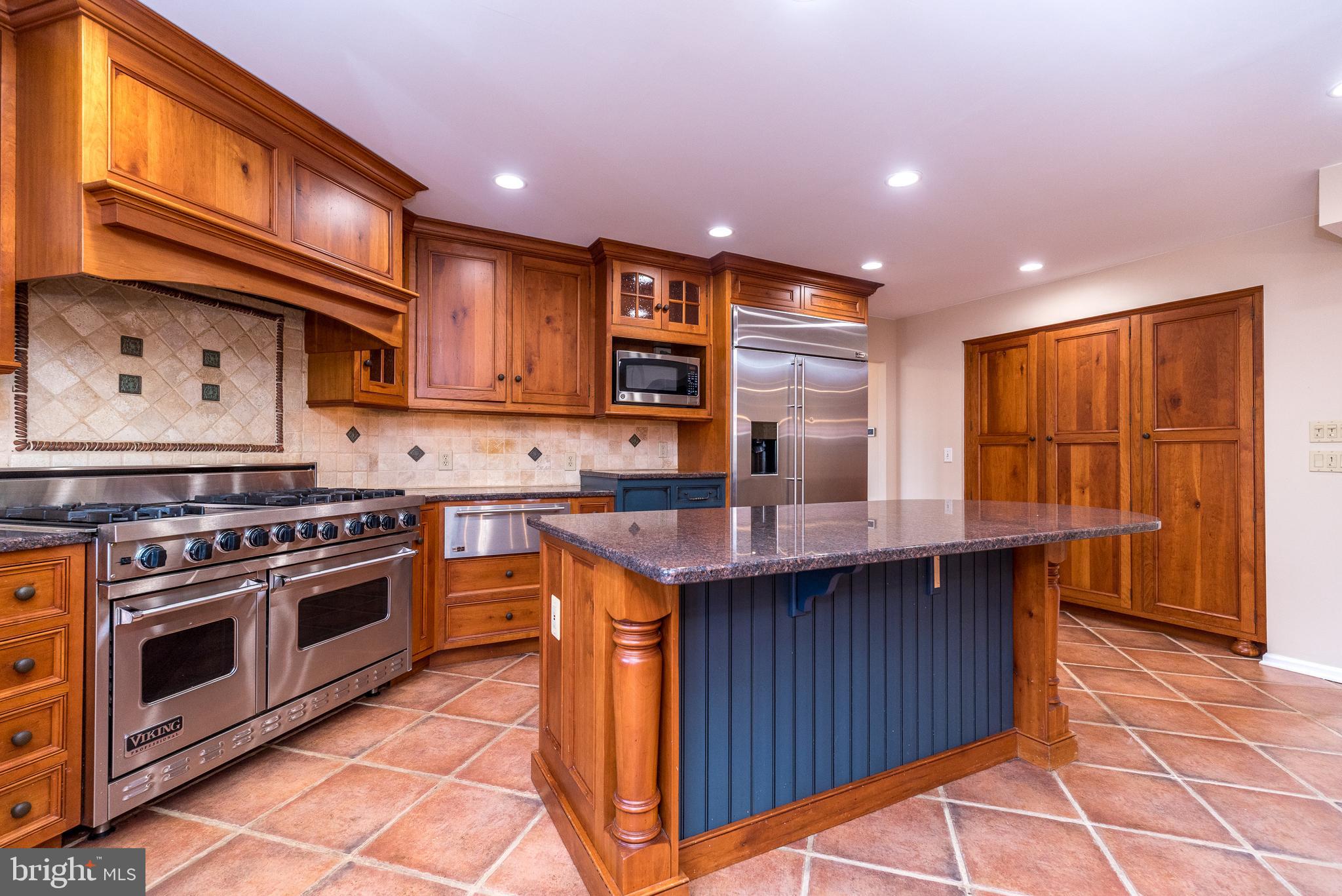 46 John Dyer Way Doylestown, PA 18902 - Photo 19 of 76 a kitchen with stainless steel appliances granite countertop a stove top oven a sink dishwasher and cabinets with wooden floor