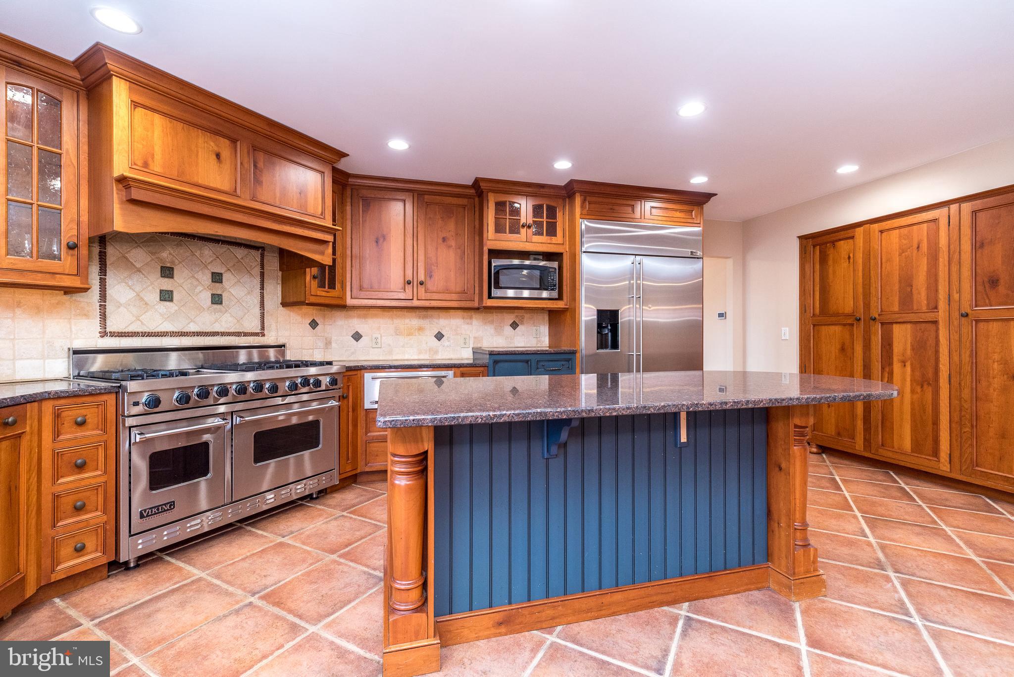 46 John Dyer Way Doylestown, PA 18902 - Photo 21 of 76 a kitchen with stainless steel appliances granite countertop a stove a sink and a microwave