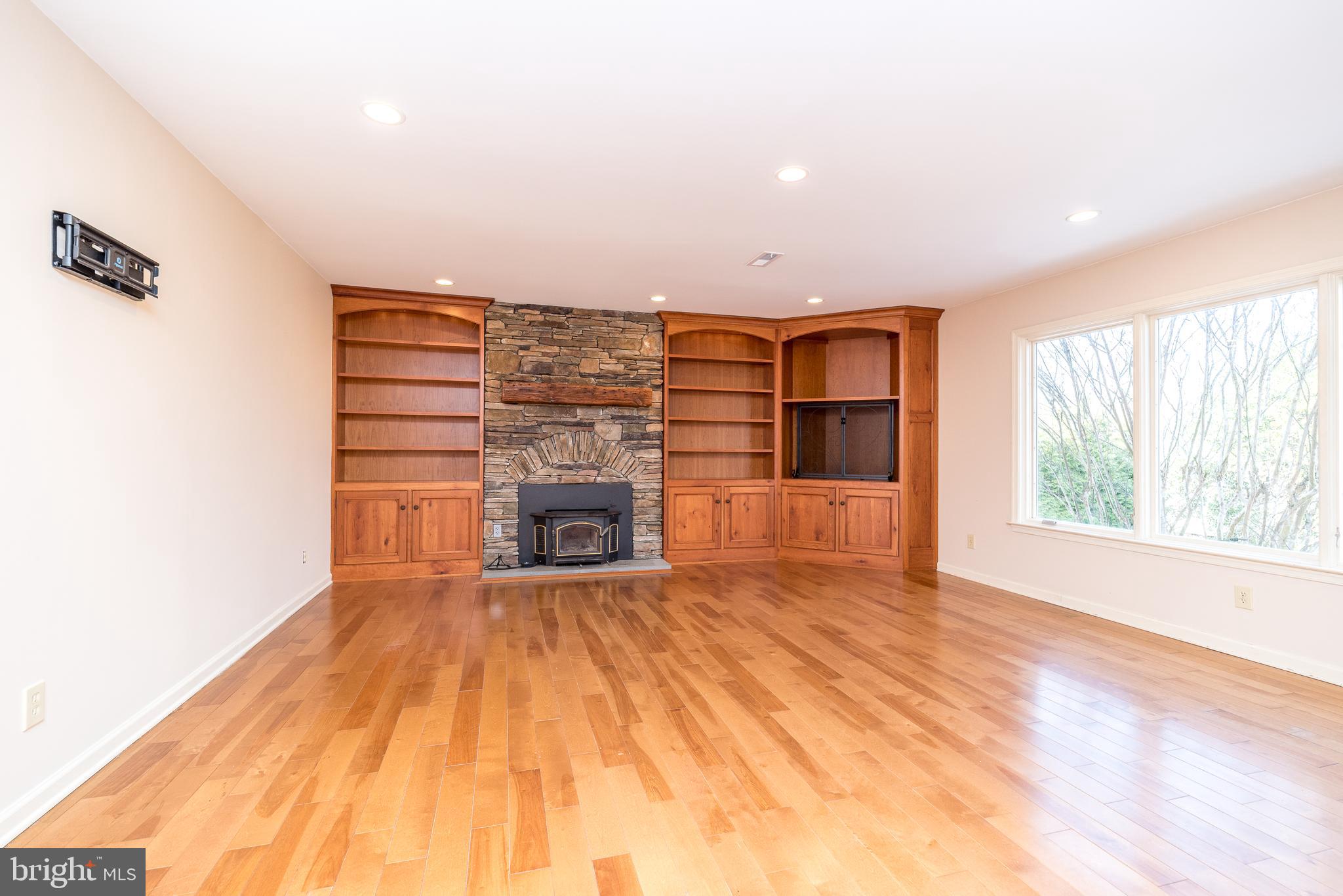 46 John Dyer Way Doylestown, PA 18902 - Photo 30 of 76 a view of empty room with wooden floor and fireplace