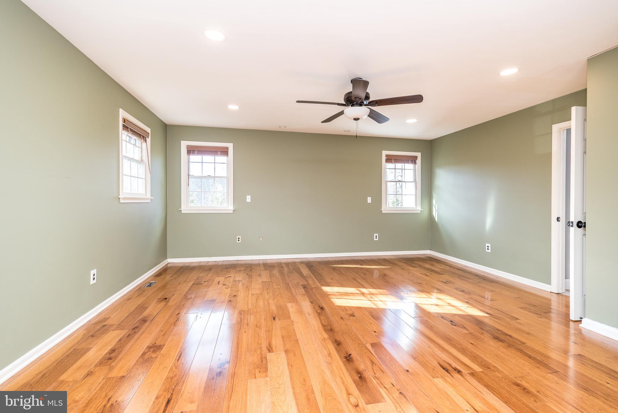 46 John Dyer Way Doylestown, PA 18902 - Photo 42 of 76 a view of empty room with wooden floor and fan