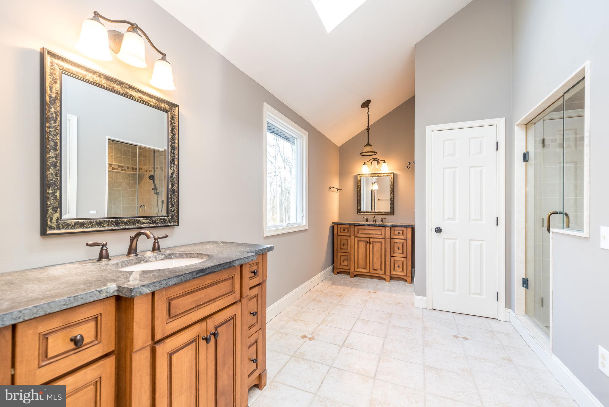 46 John Dyer Way Doylestown, PA 18902 - Photo 43 of 76 a bathroom with a granite countertop double vanity sink a mirror and a