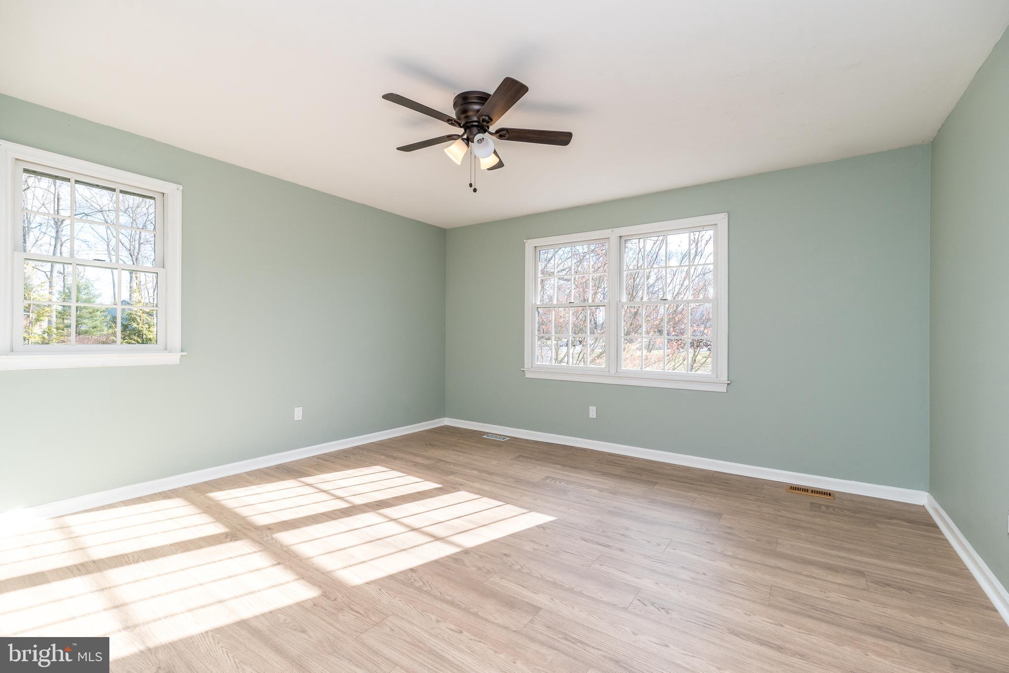 46 John Dyer Way Doylestown, PA 18902 - Photo 53 of 76 a view of empty room with wooden floor and fan
