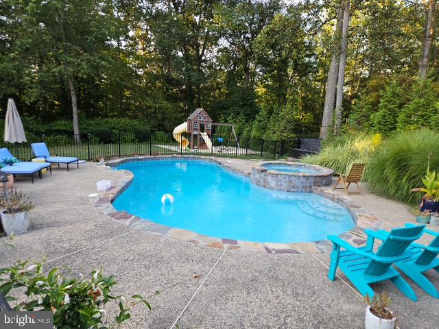 46 John Dyer Way Doylestown, PA 18902 - Photo 70 of 76 a view of a swimming pool with a patio and fire pit