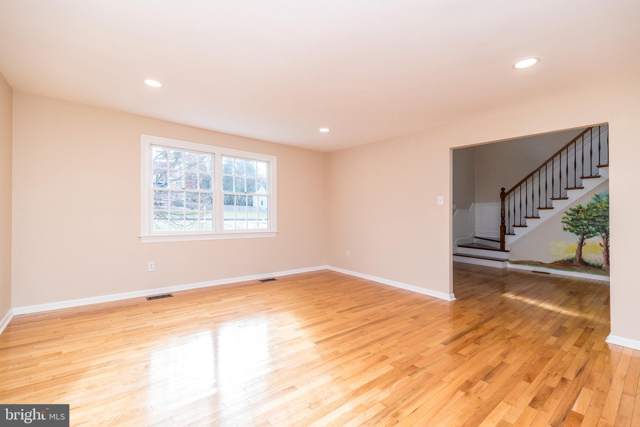 46 John Dyer Way Doylestown, PA 18902 - Photo 10 of 76 a view of an empty room with wooden floor and a window