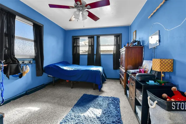 a bedroom with bed or couch and a window