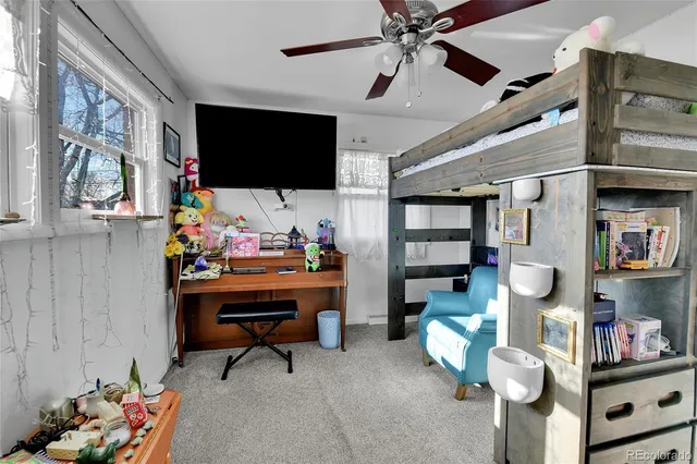 a room with furniture and a flat screen tv