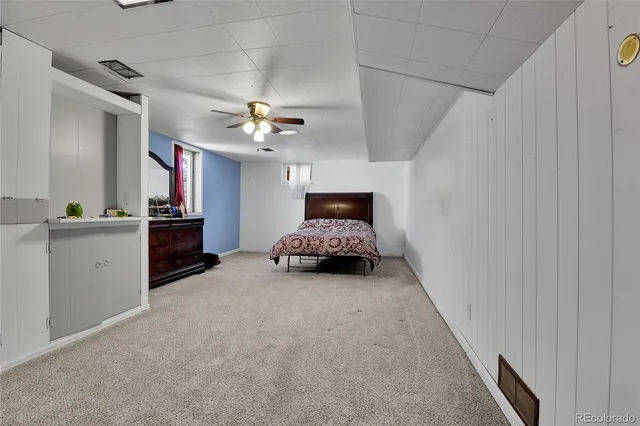 a bed room with a bed and a chandelier