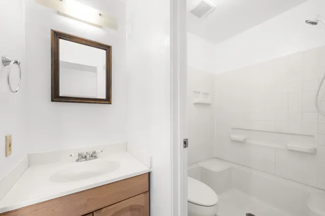a bathroom with a sink toilet and vanity