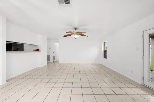 a view of a livingroom with an empty space and a sink