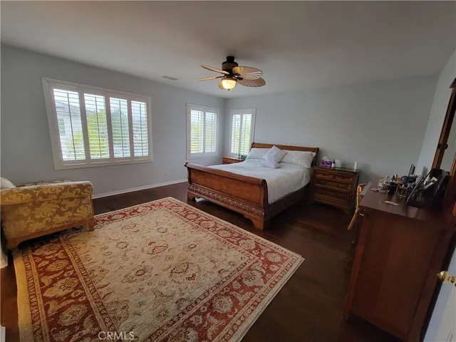 a bedroom with bed and a window