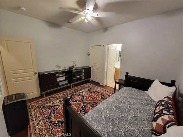 a bedroom with a bed and dresser