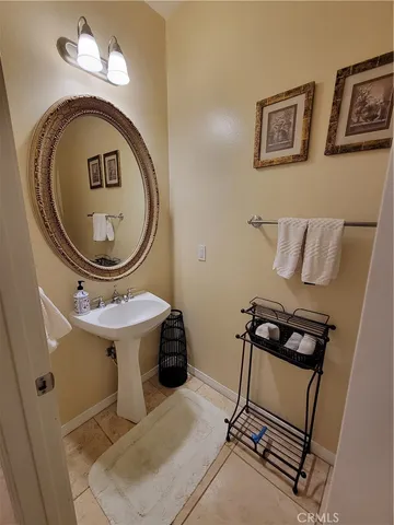 a kitchen with a sink a stove a refrigerator and cabinets