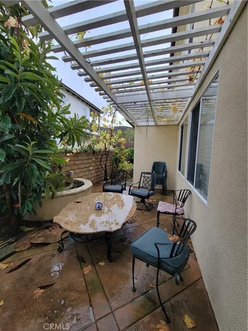 a large kitchen with stainless steel appliances kitchen island granite countertop a large counter top a stove a chimney a sink and cabinets