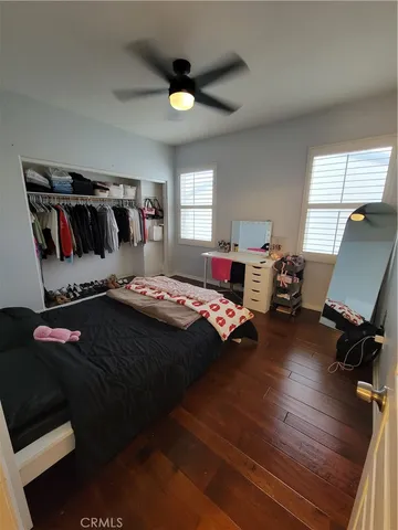 a bedroom with bed and window