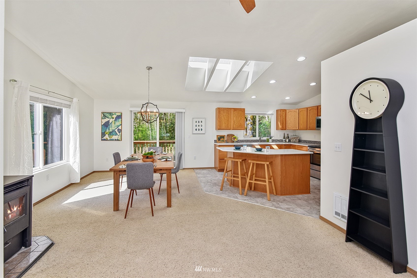 8963 Miller Road Northeast Bainbridge Island, WA 98110 - Photo 11 of 35 a view of a kitchen with a table and chairs
