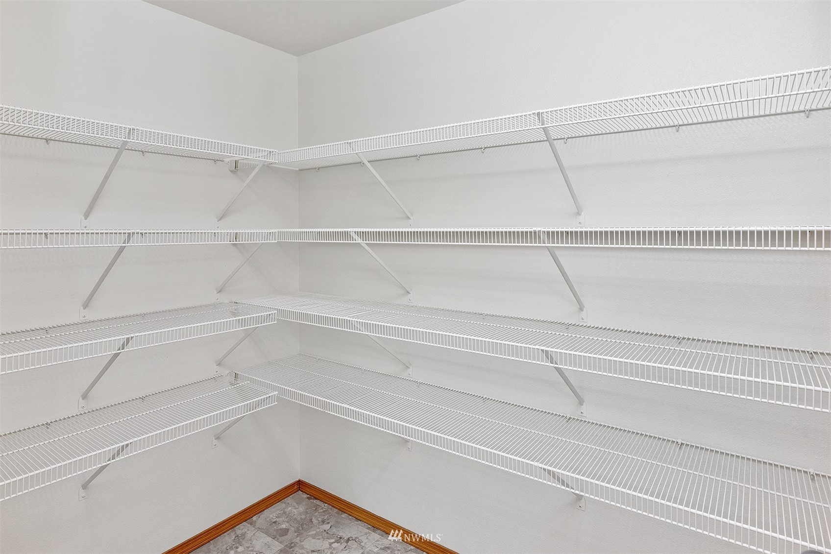 8963 Miller Road Northeast Bainbridge Island, WA 98110 - Photo 18 of 35 a view of a room with racks on the wall