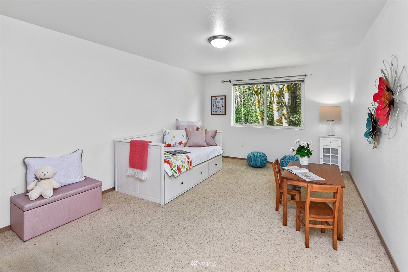 8963 Miller Road Northeast Bainbridge Island, WA 98110 - Photo 20 of 35 a bedroom with furniture and a bed