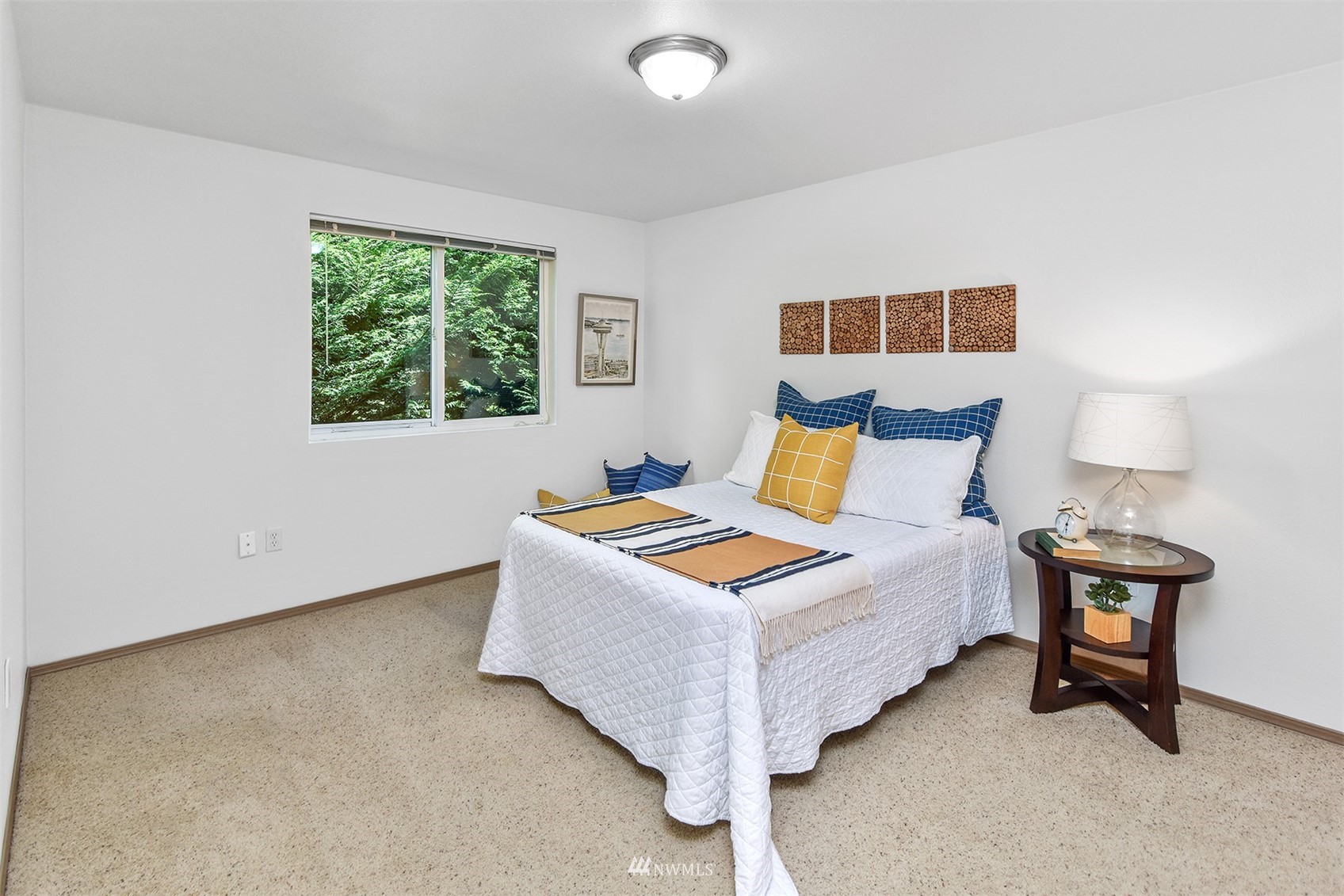 8963 Miller Road Northeast Bainbridge Island, WA 98110 - Photo 23 of 35 a bedroom with a bed and window