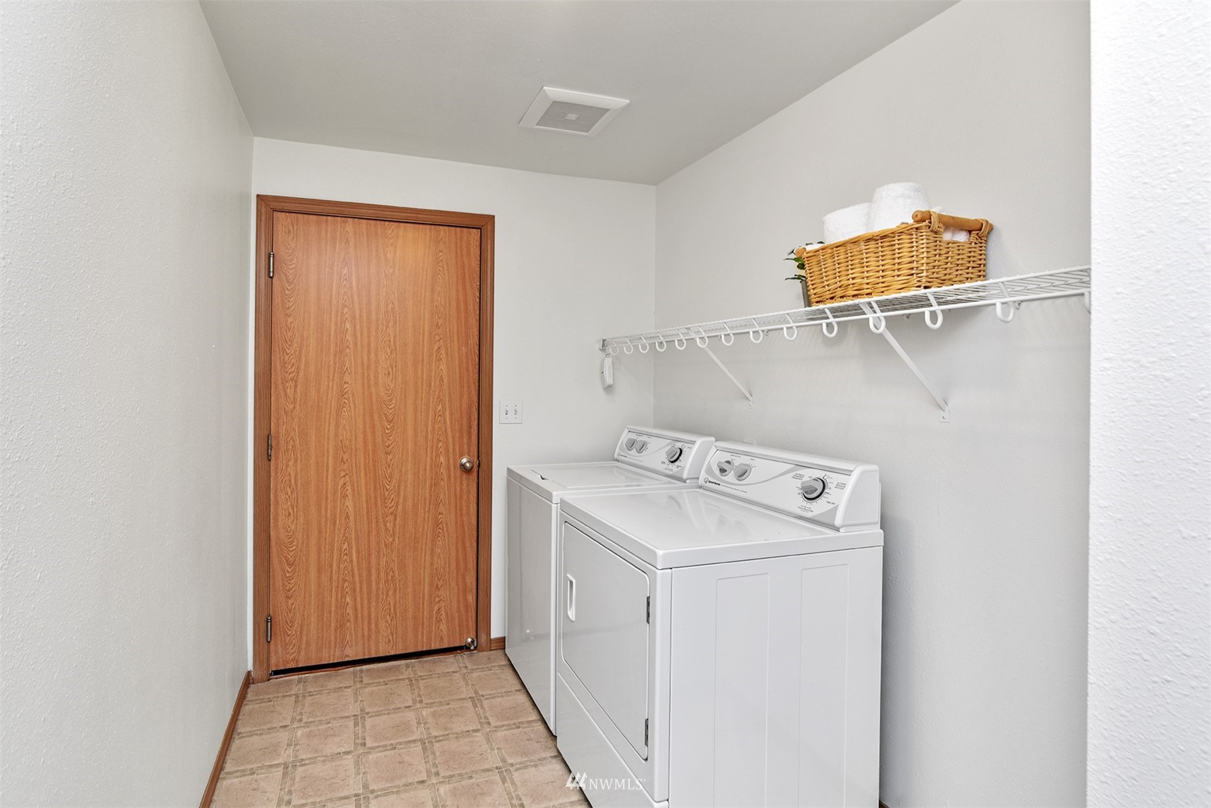8963 Miller Road Northeast Bainbridge Island, WA 98110 - Photo 24 of 35 a utility room with dryer and washer