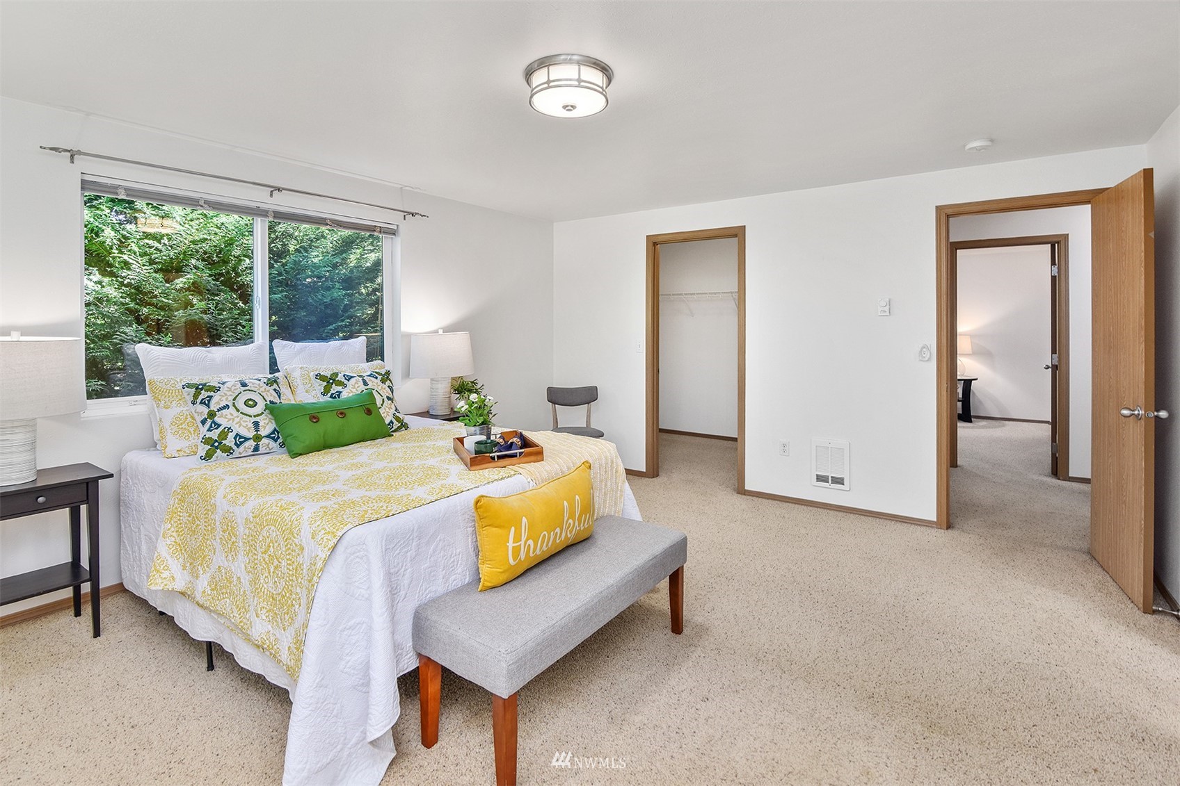 8963 Miller Road Northeast Bainbridge Island, WA 98110 - Photo 26 of 35 a bed room with a bed and a chair