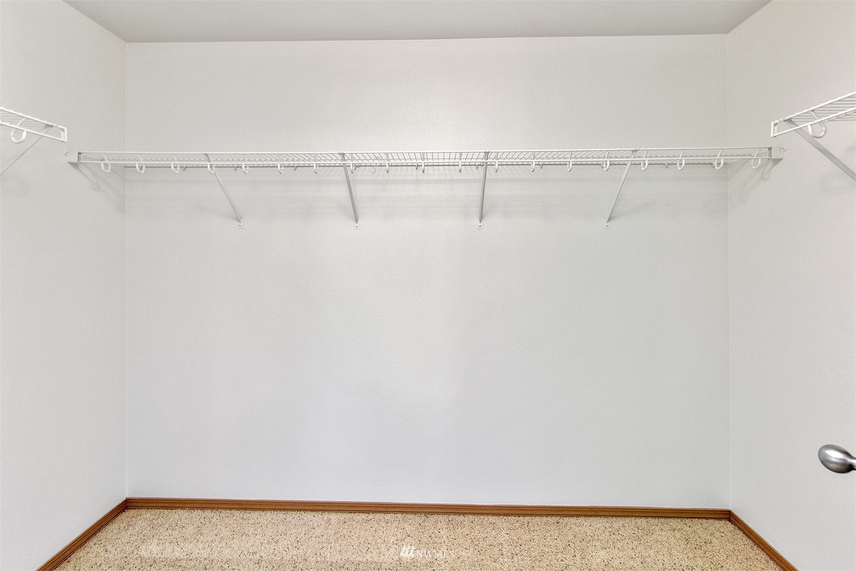 8963 Miller Road Northeast Bainbridge Island, WA 98110 - Photo 27 of 35 a view of a room with racks on the wall