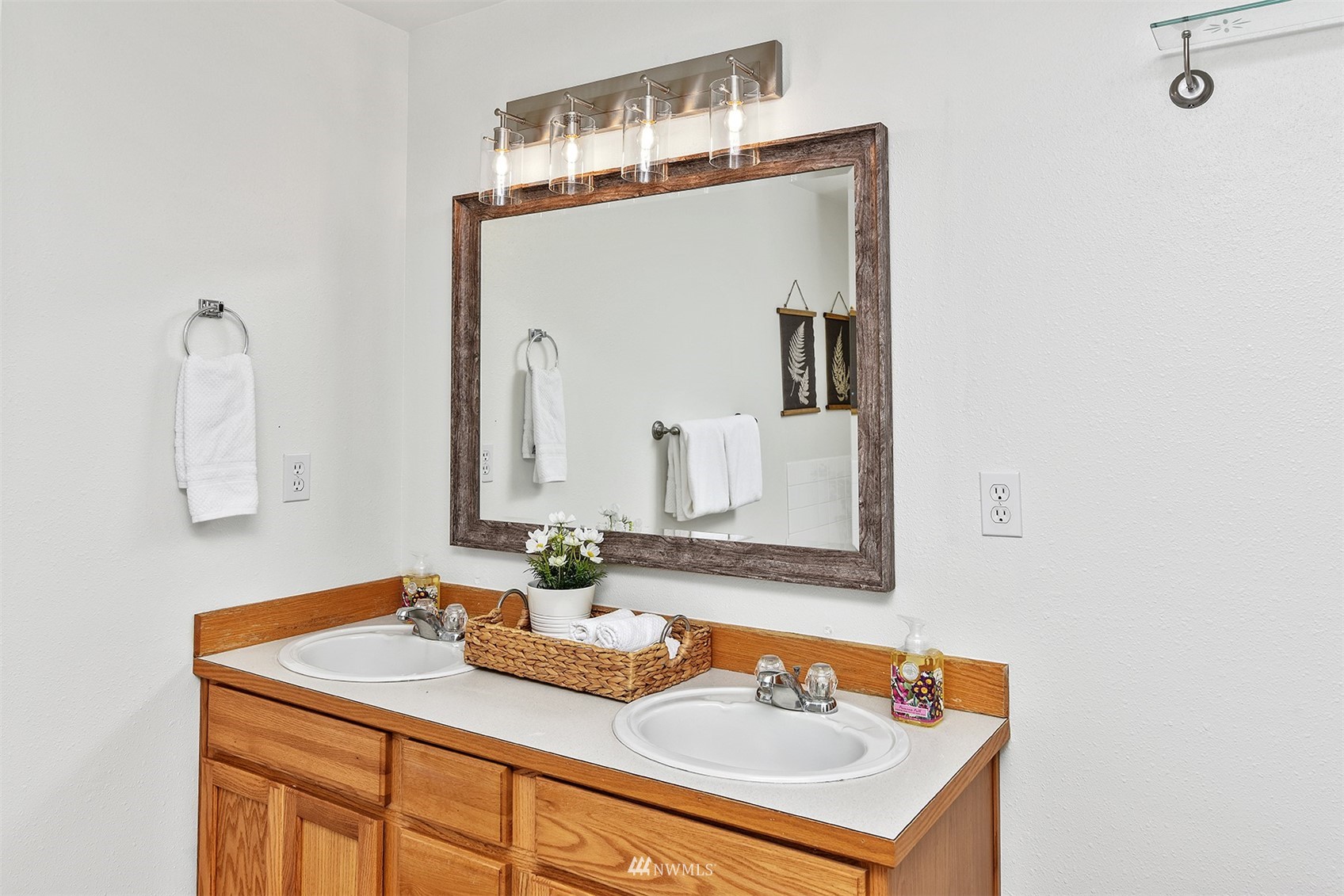 8963 Miller Road Northeast Bainbridge Island, WA 98110 - Photo 29 of 35 a bathroom with a sink and a mirror