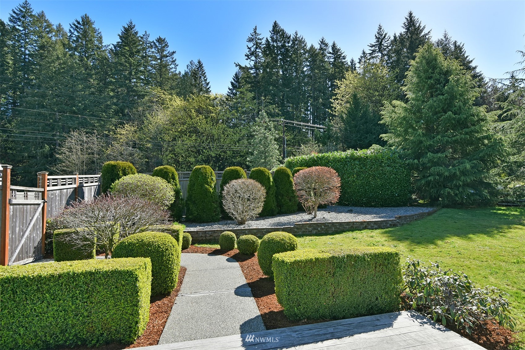 8963 Miller Road Northeast Bainbridge Island, WA 98110 - Photo 31 of 35 a view of two chairs in a patio