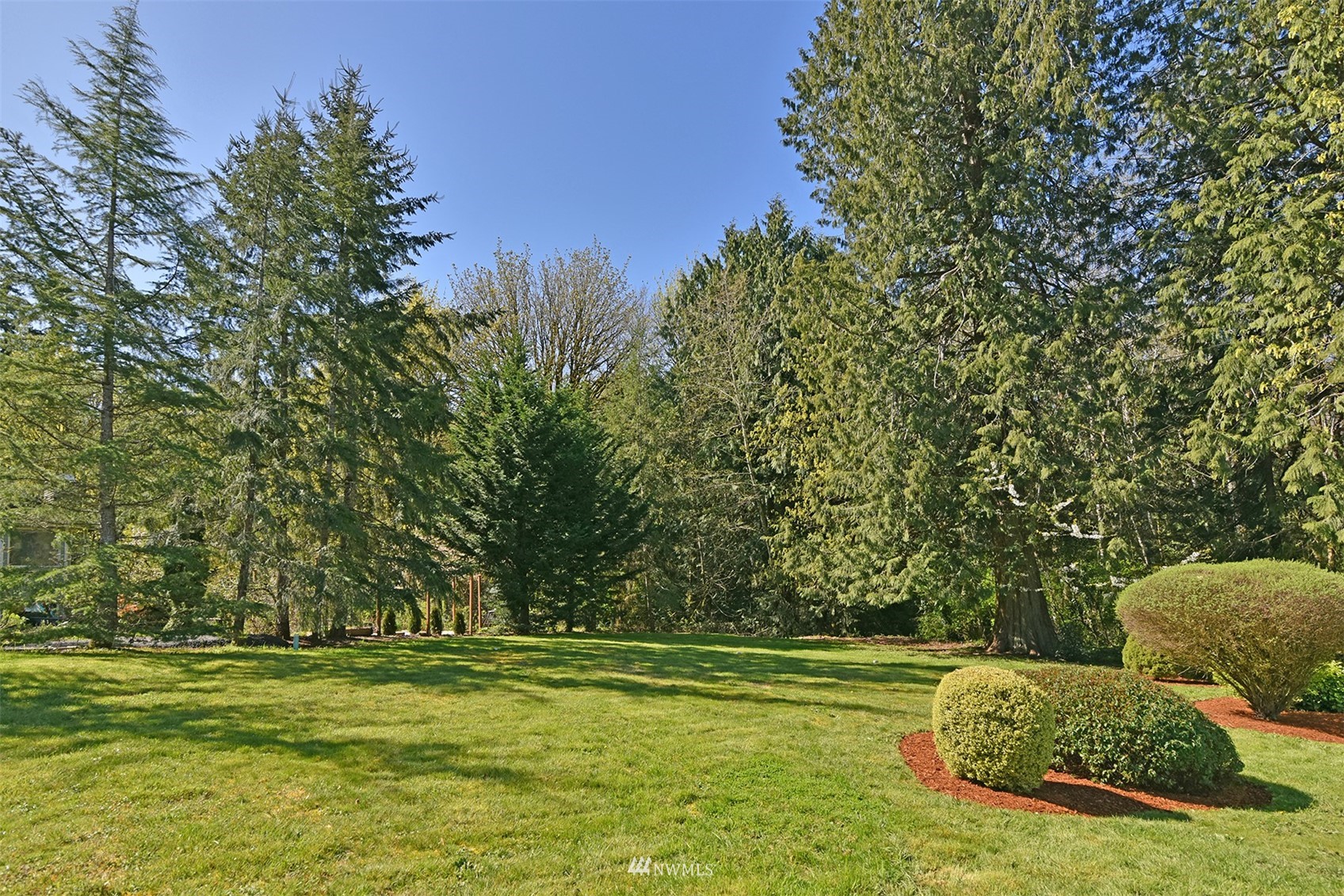 8963 Miller Road Northeast Bainbridge Island, WA 98110 - Photo 32 of 35 a view of a park with large trees