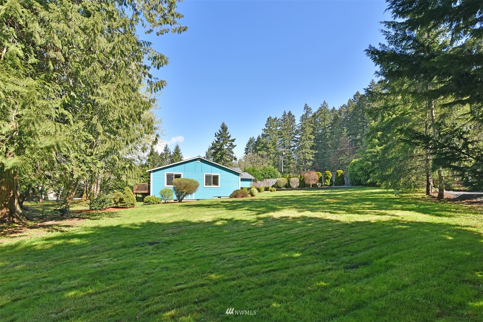 8963 Miller Road Northeast Bainbridge Island, WA 98110 - Photo 35 of 35 a view of a house with a big yard