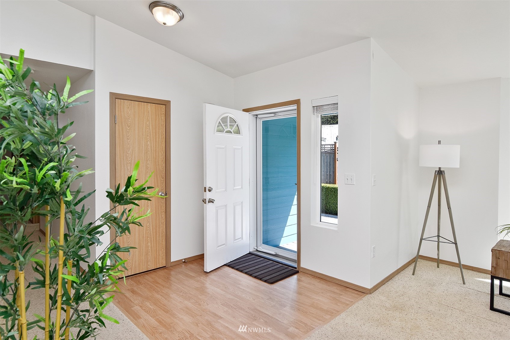 8963 Miller Road Northeast Bainbridge Island, WA 98110 - Photo 7 of 35 a view of an entryway with wooden floor and a potted plant
