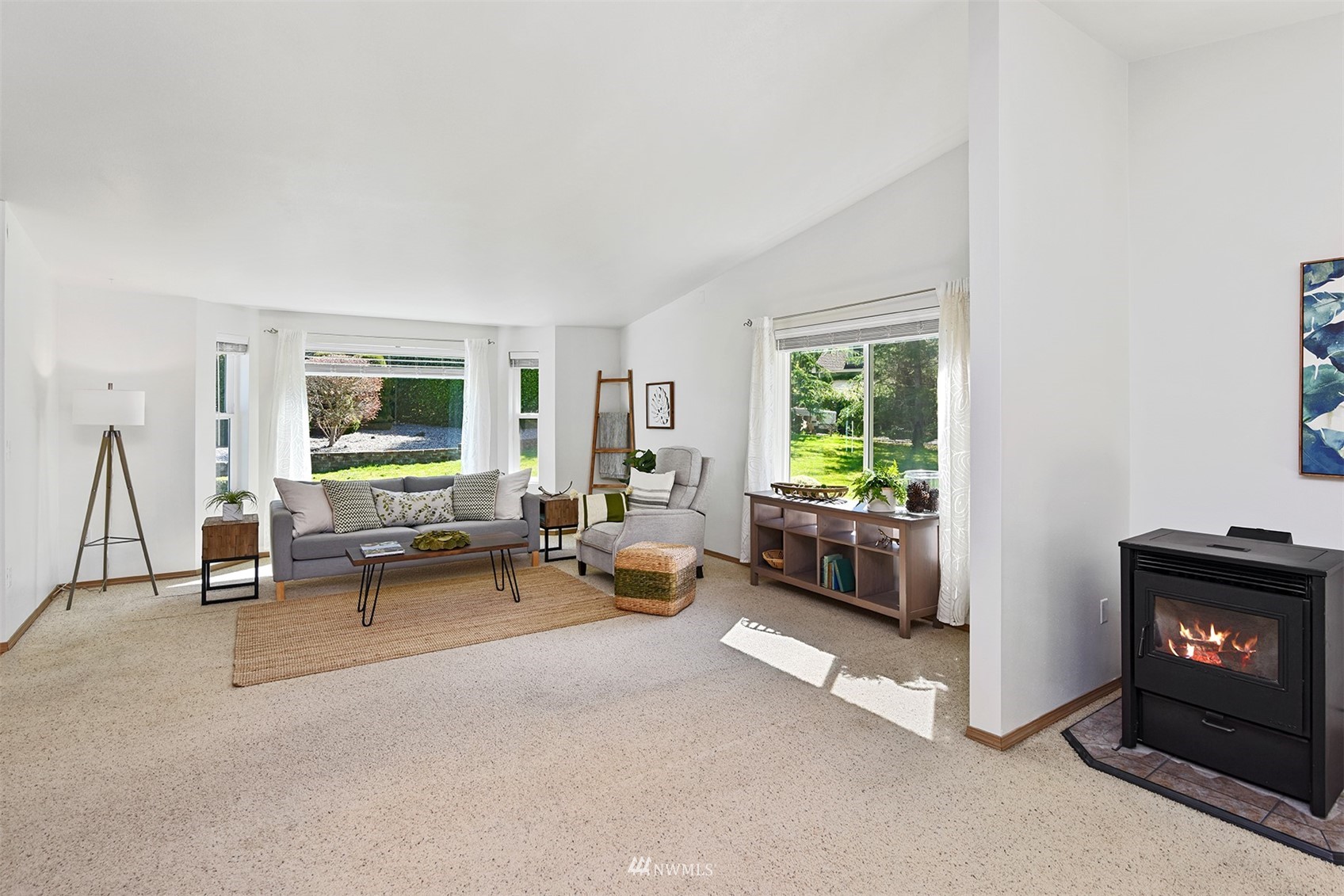8963 Miller Road Northeast Bainbridge Island, WA 98110 - Photo 9 of 35 a living room with furniture and a fireplace