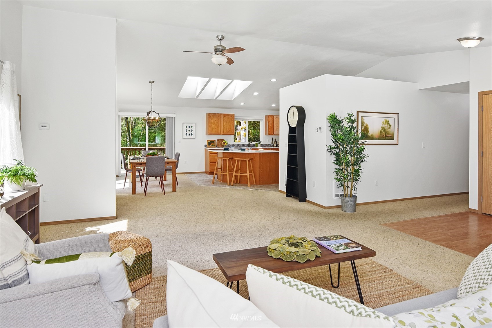 8963 Miller Road Northeast Bainbridge Island, WA 98110 - Photo 10 of 35 a living room with furniture and a wooden floor