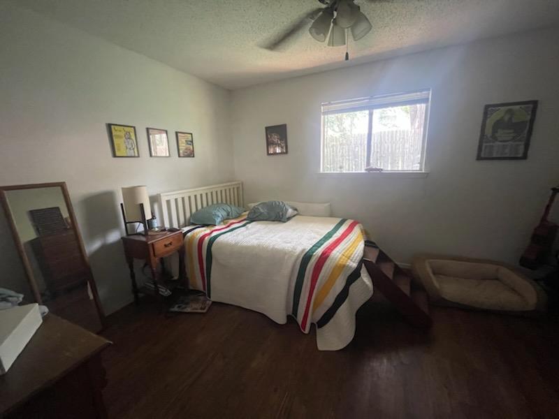 907 B Sirocco Drive Austin, TX 78745 - Photo 18 of 20 a bedroom with a bed chair and window