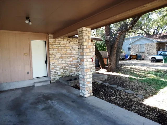 a view of a house with a tree