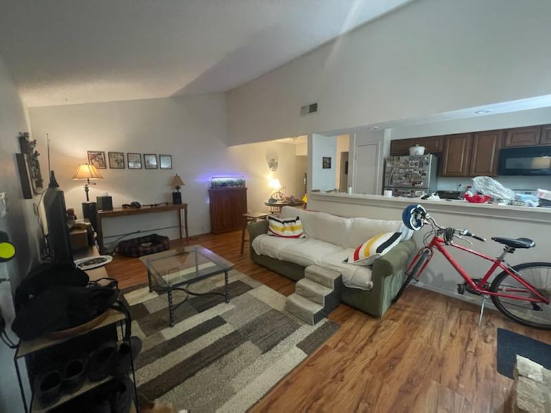 907 B Sirocco Drive Austin, TX 78745 - Photo 19 of 20 a living room with furniture and a wooden floor