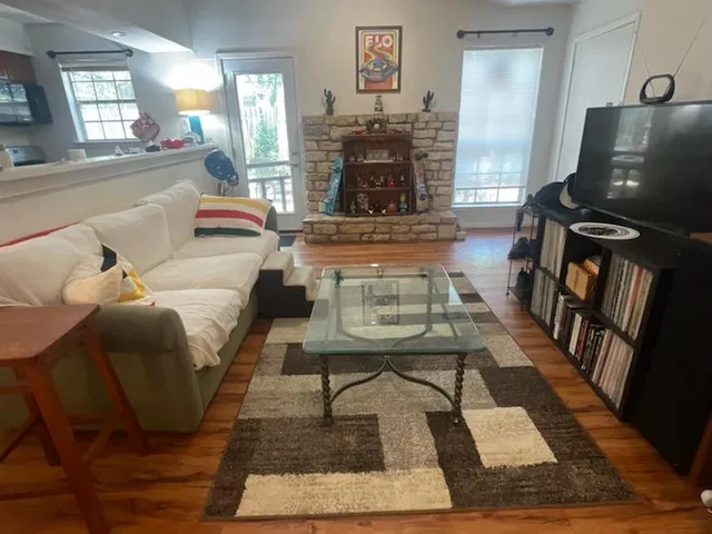 a living room with furniture and a fireplace