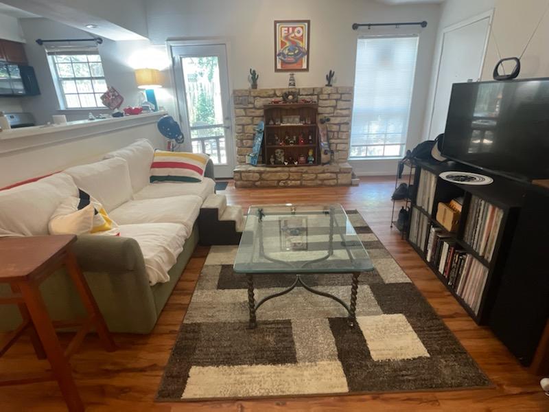 907 B Sirocco Drive Austin, TX 78745 - Photo 20 of 20 a living room with furniture and a fireplace