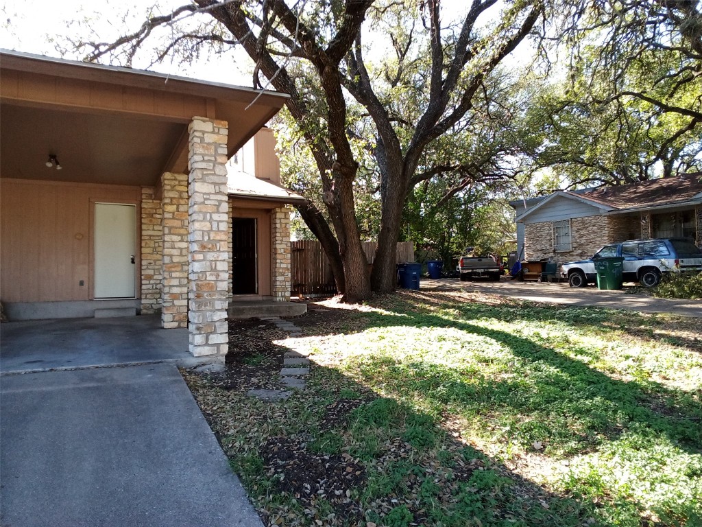 907 B Sirocco Drive Austin, TX 78745 - Photo 2 of 20 a view of a house with a yard