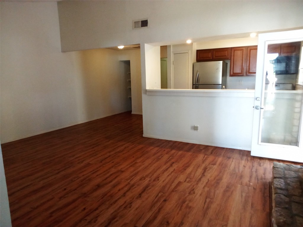 907 B Sirocco Drive Austin, TX 78745 - Photo 5 of 20 a view of a kitchen cabinets and wooden floor