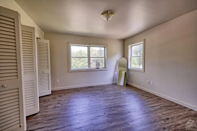 a spacious bathroom with a sink toilet vanity and tub