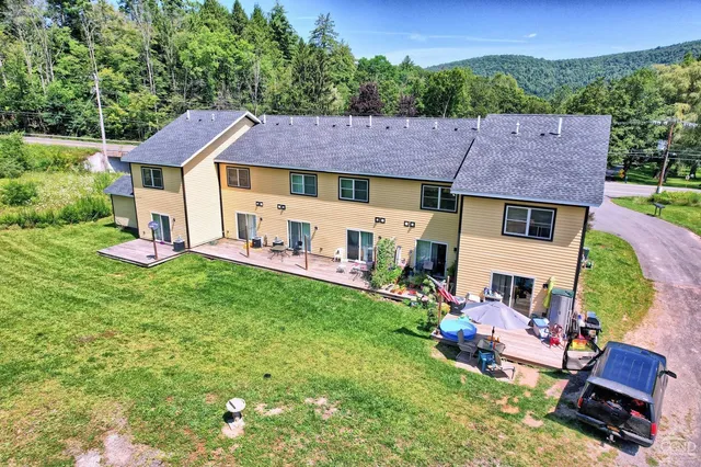 an aerial view of house with yard